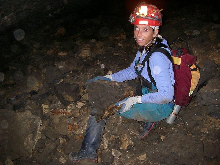 new-trout-30.JPG - Tara poses with a rock the approximate size of one that bounced off her foot and ankle a year ago, in a different cave.  ROCK!!